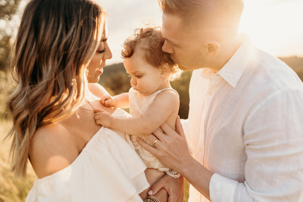 out door sunset photoshoot. family of 3 sunset photo.