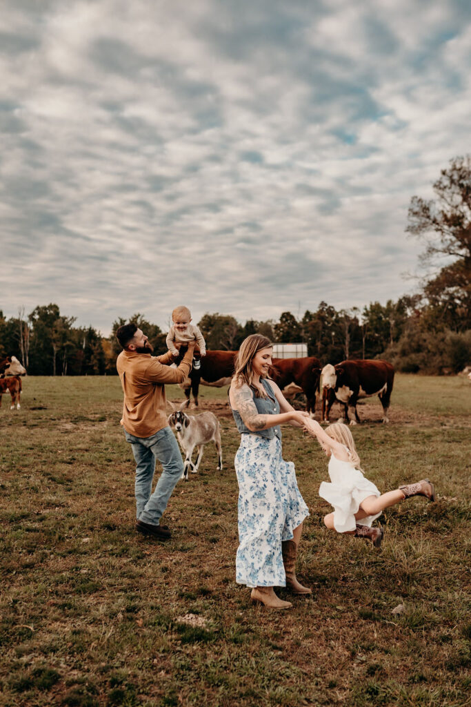 booking family photos early to capture authentic moments of mom and dad playing with kids