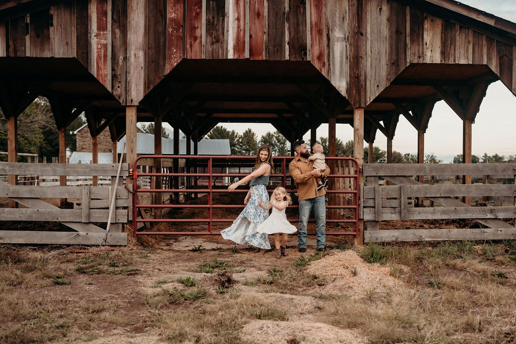 family dancing in front of barn in farm in Pennsylvania