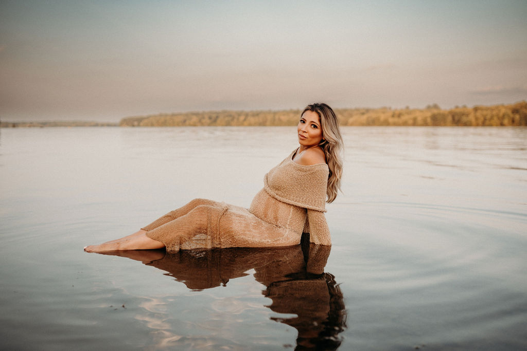 mom sitting in water at lake nockamixin in summer 