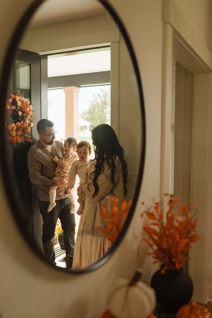 family through mirror shot in family photos