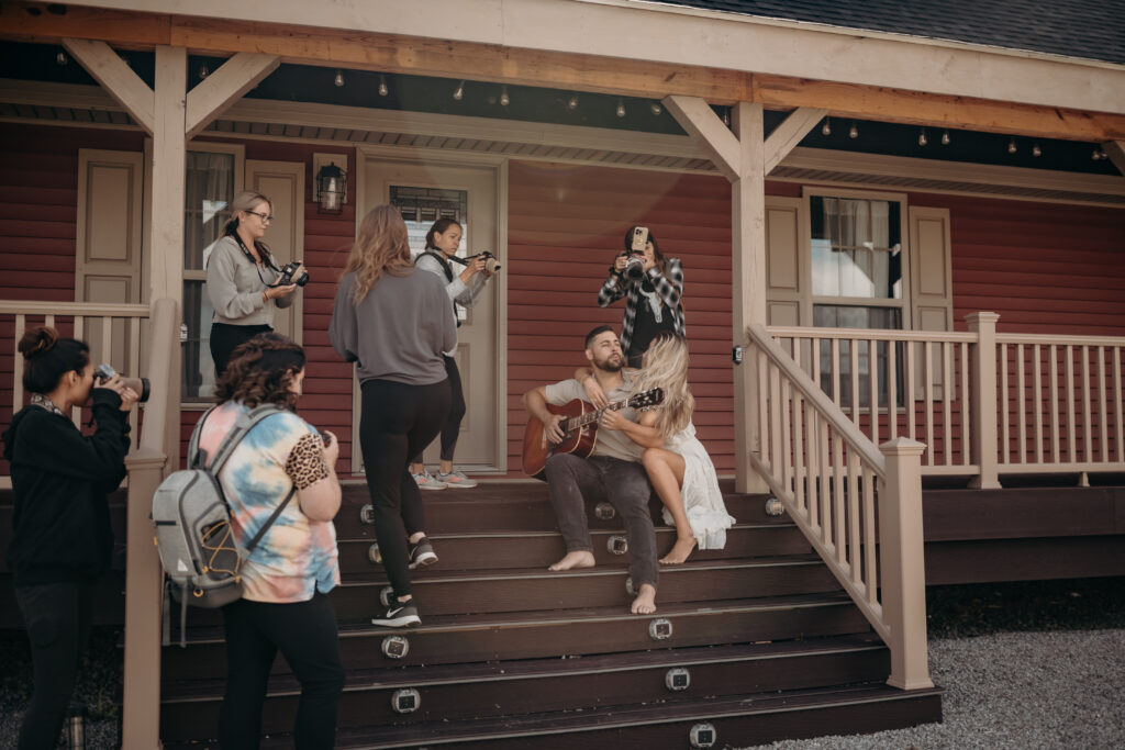 A photographer captures a stunning moment of a couple posing outdoors in front of a home—perfect for Lehigh Valley family photographers
