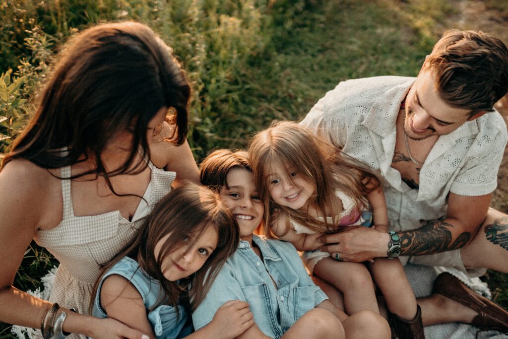 hugging families in field in spring in lehigh valley 